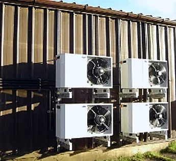Refrigeration condensing units fitted to a building wall